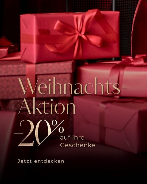 Rote Geschenkschachteln mit Bändern, die hinter einem goldenen deutschen Text gestapelt sind, der einen 20%igen Weihnachtsrabatt auf Geschenke anbietet. Auf der Schaltfläche steht "Jetzt entdecken.